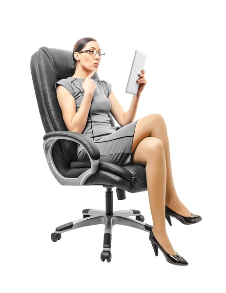 Business woman sitting on chair working with a tablet. — Stock Photo, Image