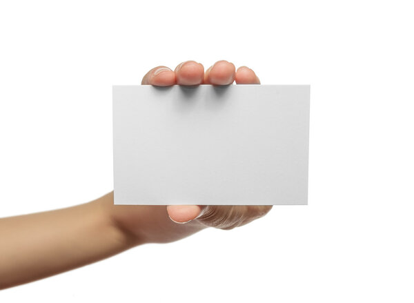 Woman holding blank business card in hand.