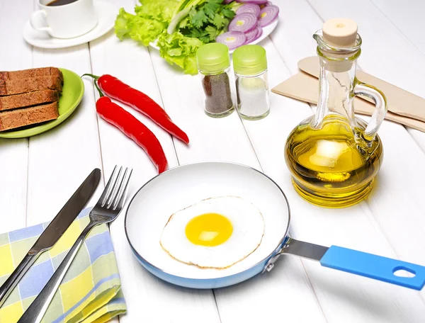 Fried eggs in a frying pan — Stock Photo, Image