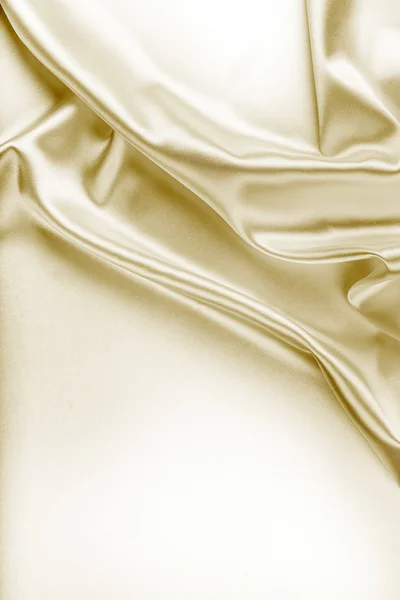 Текстура золотой шелковой ткани — стоковое фото