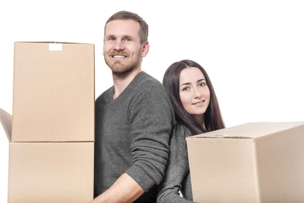 Couple with moving boxes. — Stock Photo, Image