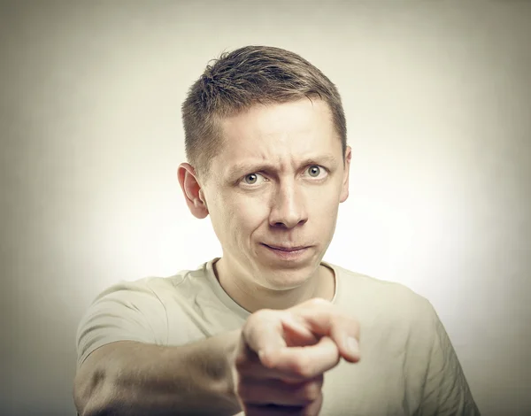 Portrait of young man pointing at you. — Stock Photo, Image