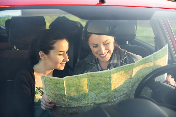 Friends in car enjoy road trip.