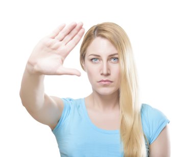 Attractive blonde woman with her hand holding it at arm's length.