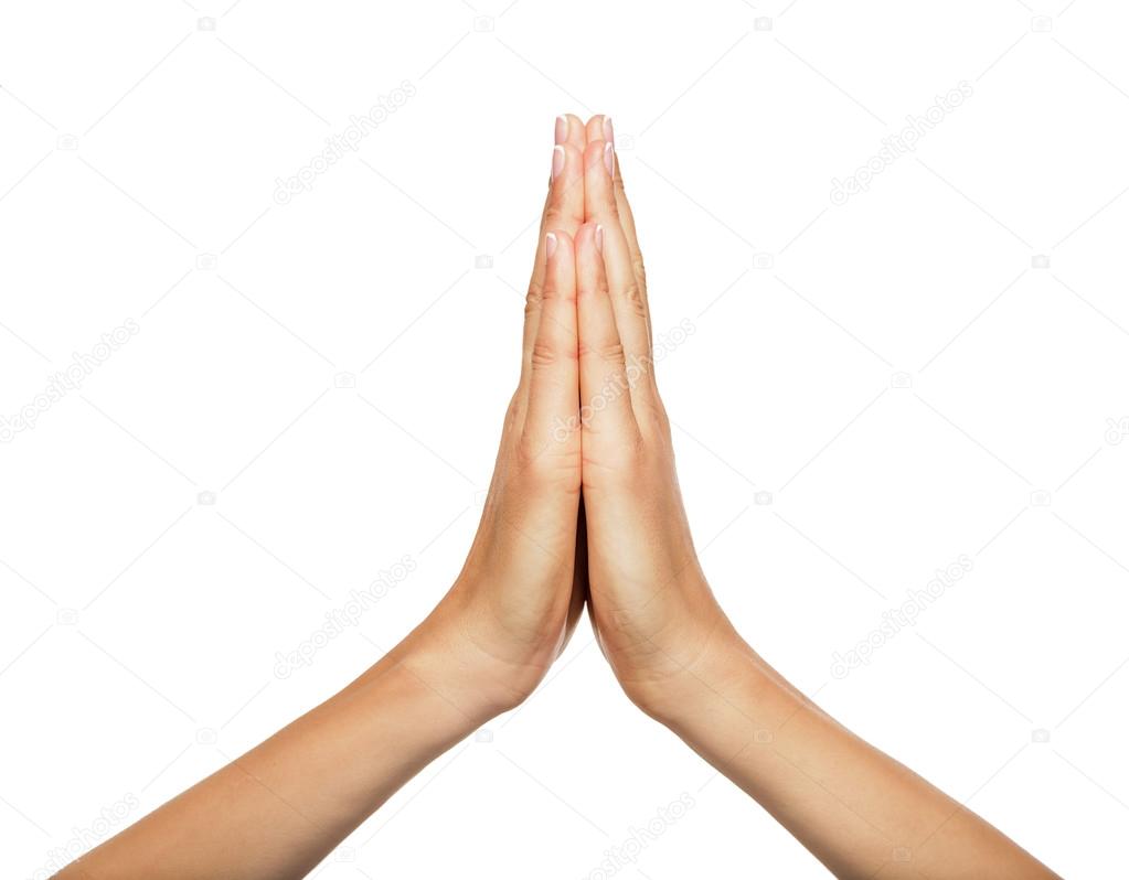 Praying hands of a woman.