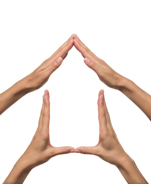 Mãos formando uma forma de casa . — Fotografia de Stock