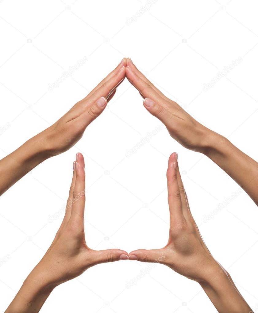 Hands forming a house shape.