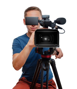 A professional cameraman operating a video camera on a tripod, focusing through the viewfinder against a white background.