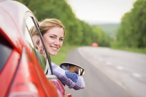 Woman in red car. — Stock Photo, Image