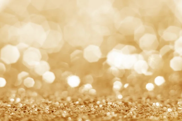 Guld defocused glitter bakgrund. — Stockfoto