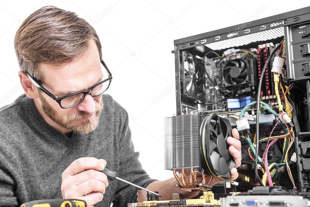 Computer technician installs cooling system.