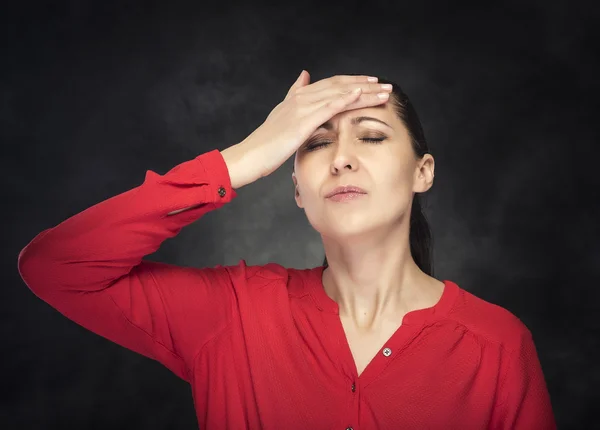 Woman experiencing a headache. — Stock Photo, Image