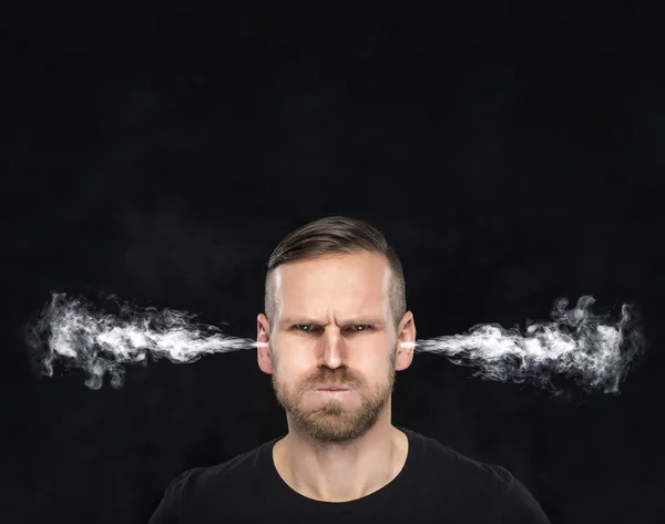 Angry man with smoke coming out from his ears. — Stock Photo, Image