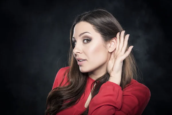 Beautiful young woman listening. — Stock Photo, Image