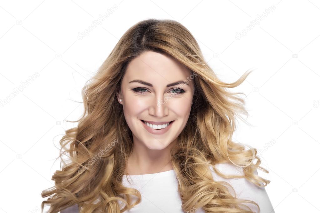 Attractive blonde smiling woman portrait.