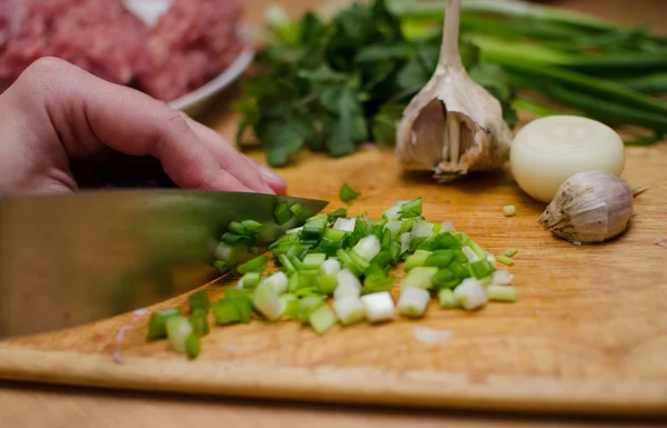 Sliced onion with a knife — Stock Photo, Image