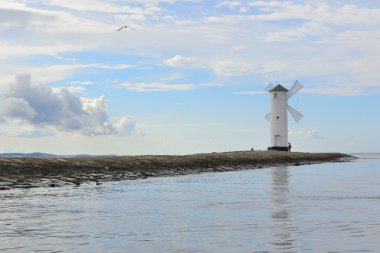 Lighthouse - windmill on the breakwater - Swinoujscie clipart