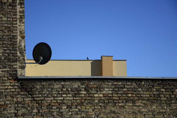 Old brick wall on a background of blue sky