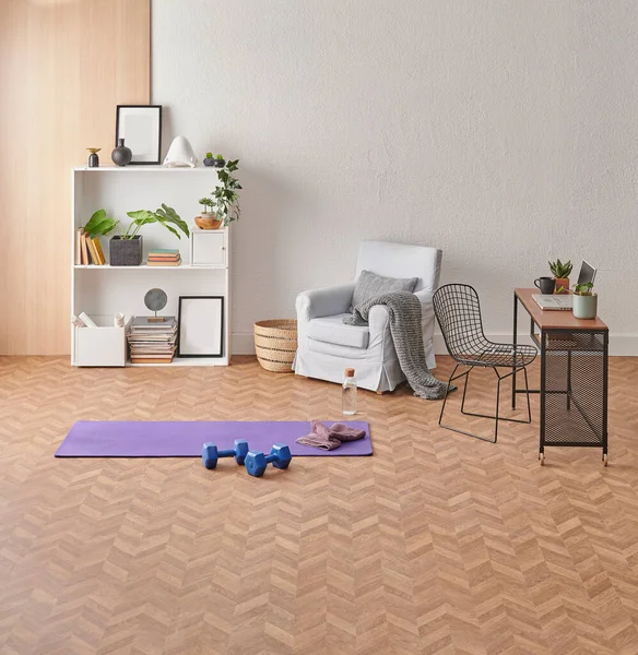 Training at home concept, interior, decorative sport in the room with gym fitness exercise purple mat, dumbbell and bicycle.