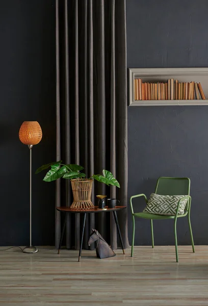 Grey stone wall with chair concept and niche, orange lamp, black curtain and vase of plant style, interior style.