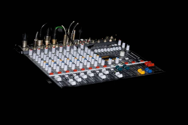 Connected music mixing console on black background — Stock Photo, Image