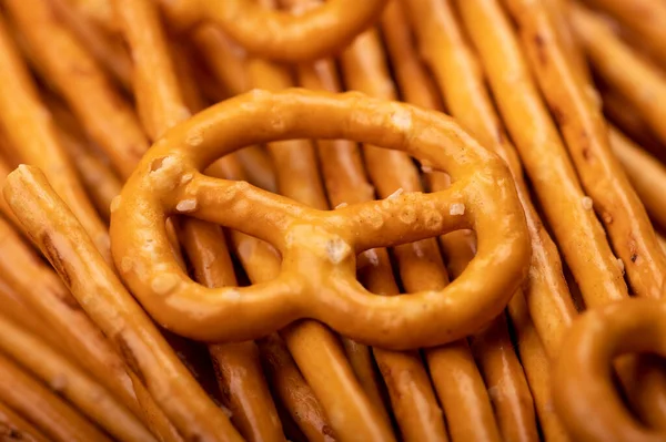 Bread sticks and bread figures with salt. Close-up Background image