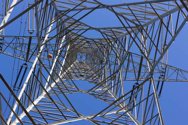 Electrical tower supporting copper cables to carry electrical energy; Engineering work to support cables carrying electricity