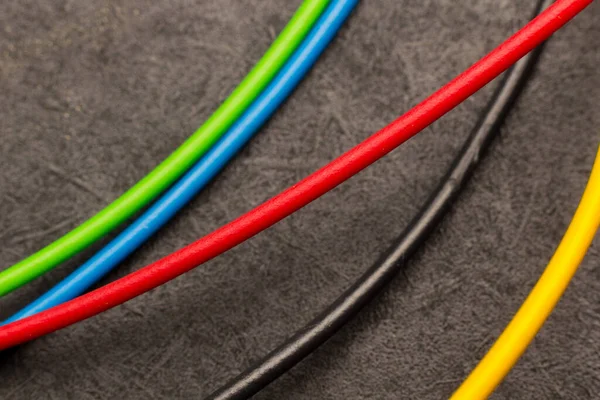 Colored electrical cables; basic colors in electrical cables. Wire scraps; small pieces of colored wires; electrical wires.