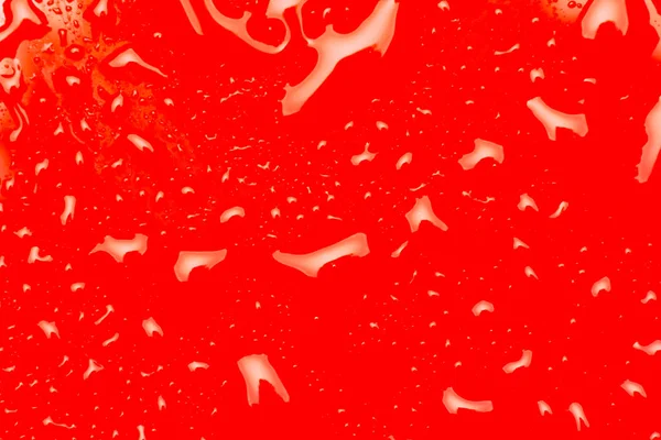 Kapky Vody Hladkém Červeném Povrchu Odrazy Světla Kapkách Vody Textura — Stock fotografie