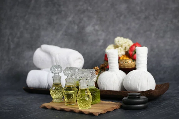 Thai massage with accesories for Asian spa with aroma herb and essential oil for skin. Hot compress ball for body and face care.