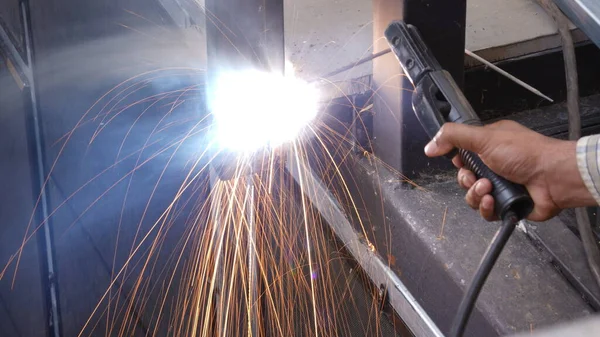 Welding and Cutting steel work of craft man with iron sawing wheel  machine in industry. Renovate home or company by industrial service.