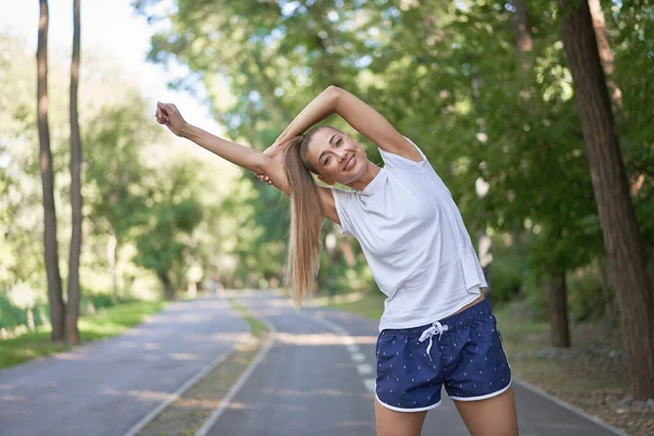 Woman Runner Stretching Arms Exercising Summer Park Morning Middle Age — Stock Photo, Image