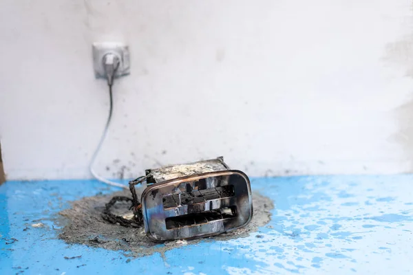 Toaster after fire. Household electrical appliance fire hazard