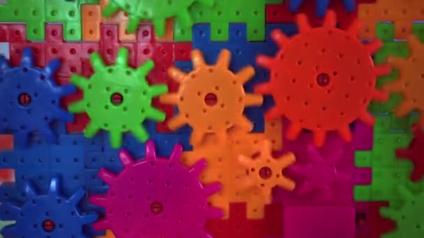 Plastic toy cogwheel Working for common goal, conceptual — Stock Video