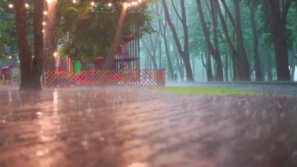 Rainy Day In City Public Park Rain Water Drop Falling To The Floor Water Splashes On Ground Heavy Rain Day — Stock Video