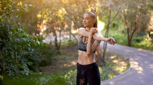 Woman Runner Stretching Arms Exercising Summer Park Morning Middle Age — Stock Photo, Image