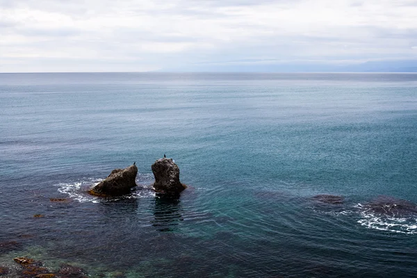 Two big rock in seaor ocean water — Stock Photo, Image