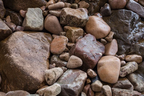 Textura de piedras marinas afiladas de diferentes tamaños — Foto de Stock