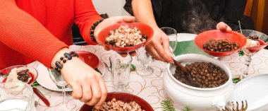 At the festive table, put on a plate boiled peas with bacon