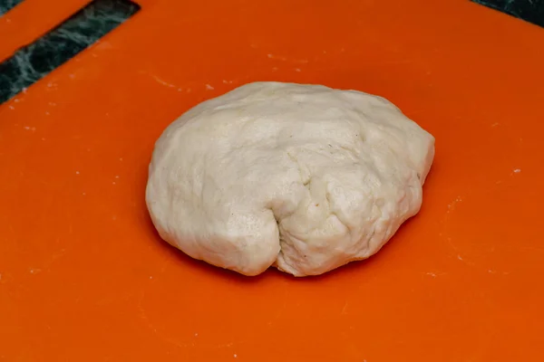 Raw dough on the table — Stock Photo, Image