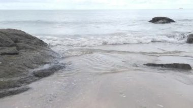 scenery of rocky boulders by the beach