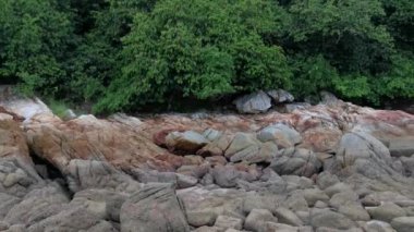 scenery of rocky boulders by the beach