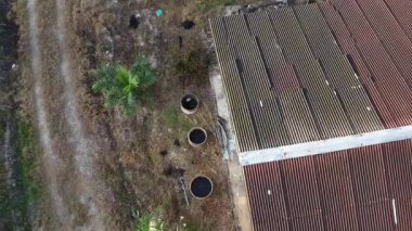 footage of the ascending flight as looking below the agriculture ground.