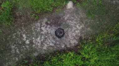 footage of the ascending flight as looking below the agriculture ground and a man walking below.