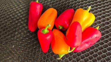 a bundle of fresh colorful sweet mini cherry pepper vegetable.