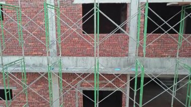 either looking out the window or door frame the outdoor construction site at early dusk or dawn time 