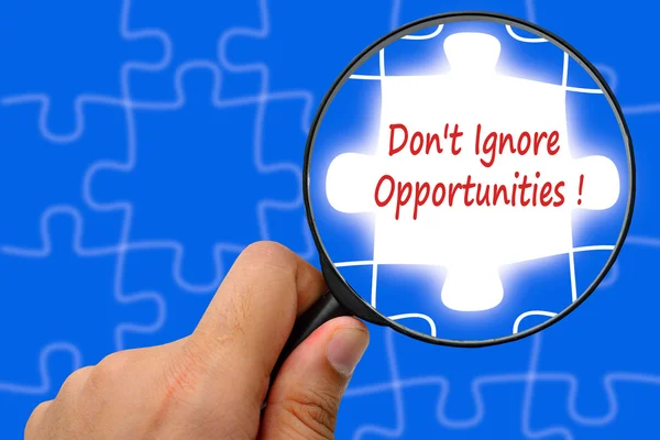 Don't Ignore Opportunities !word. Magnifier and puzzles. — Stock Photo, Image