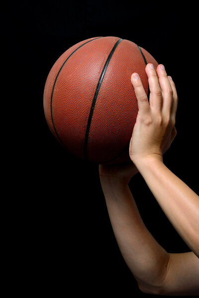 Basketball on black background.