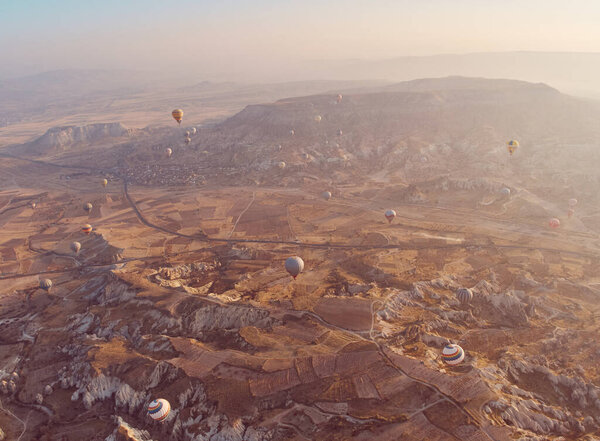 Hot air balloon in Cappadocia on the sunrise.