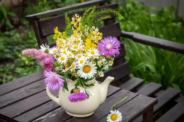 Wildflowers in an old little village teapot. Toned — Stock Photo, Image